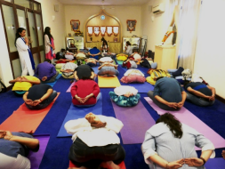 people doing yoga in classroom